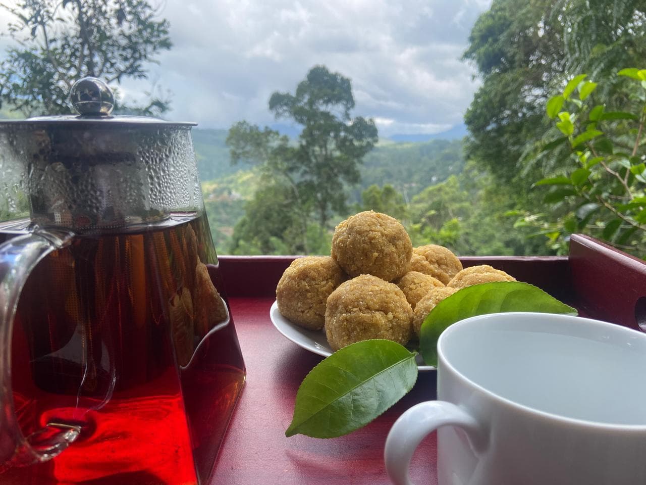 Tea and pastries overlooking the misty hills