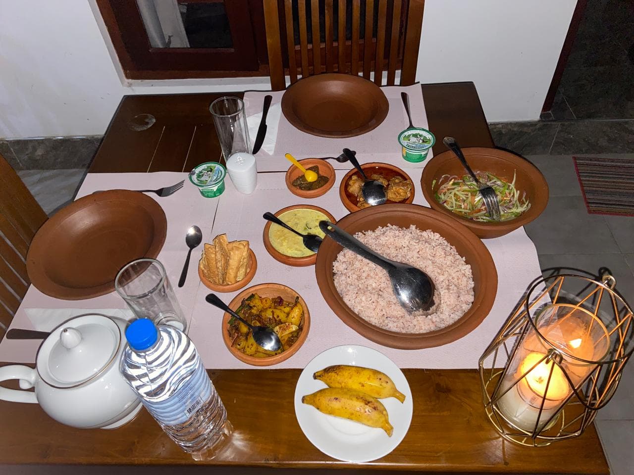 Rice and curry dinner served by candlelight