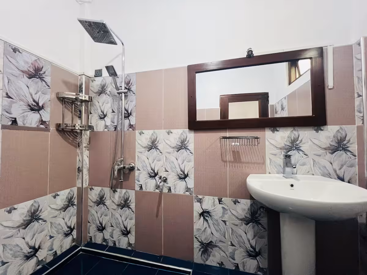 En-suite bathroom with rain shower and vanity