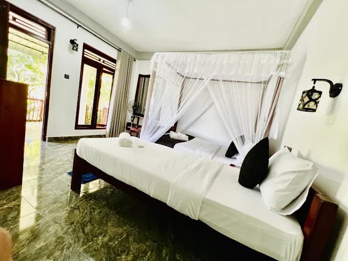 Hidden Heaven king and single beds beside the balcony doors